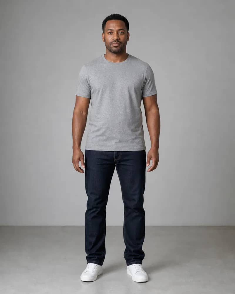 Man in a gray T-shirt and dark straight jeans before AI outfit comparison