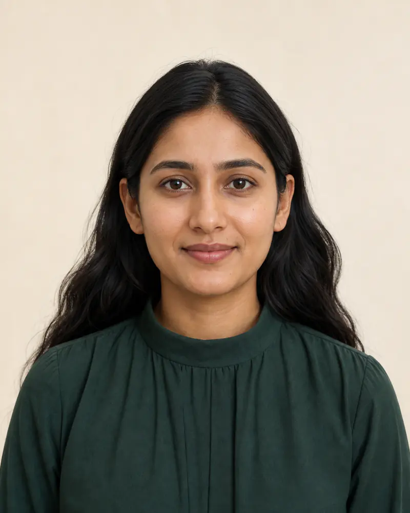 South Asian woman without eyewear before a round sunglasses try-on