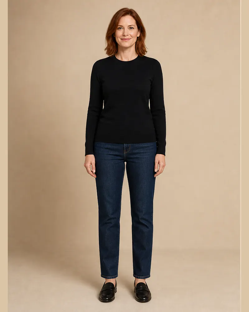 Woman wearing a black knit top and jeans before virtual suit try-on