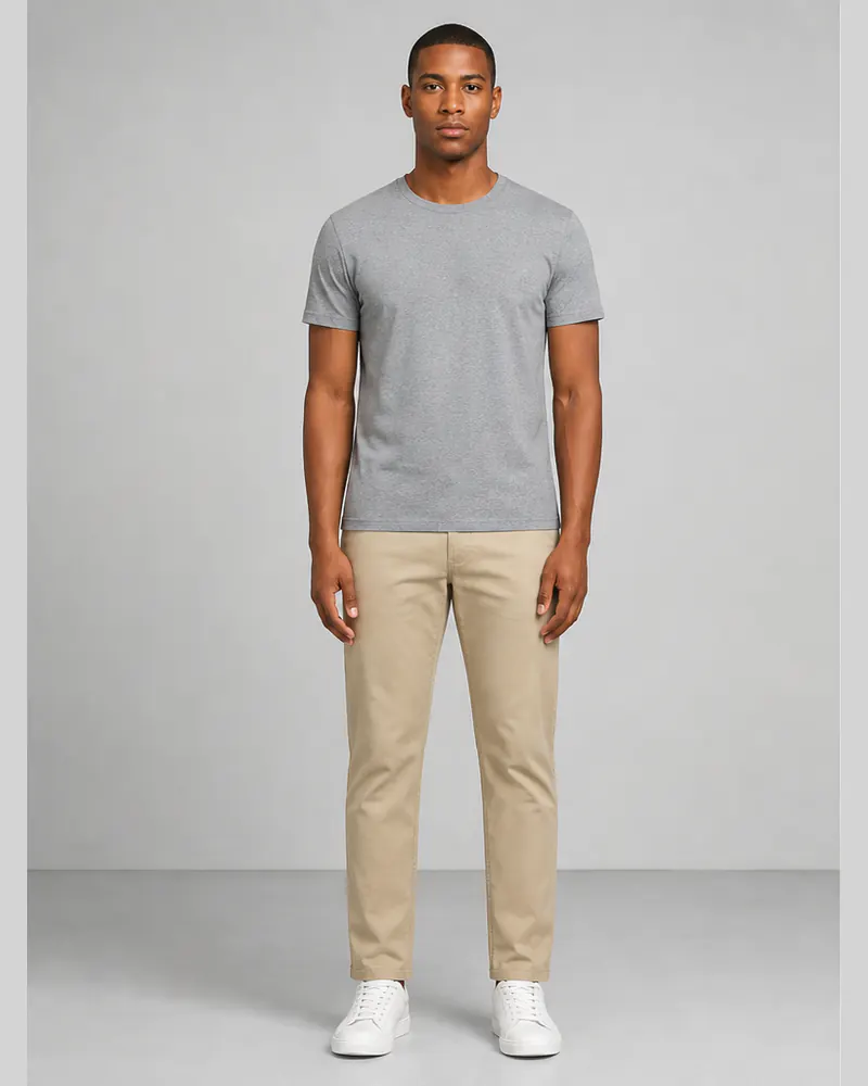 Man wearing a gray T-shirt and beige chinos before trying clothes from a retailer screenshot