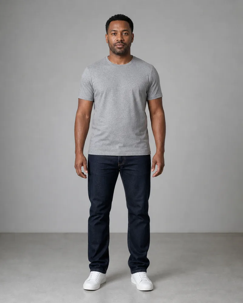 Man in a gray T-shirt and dark straight jeans before AI outfit comparison