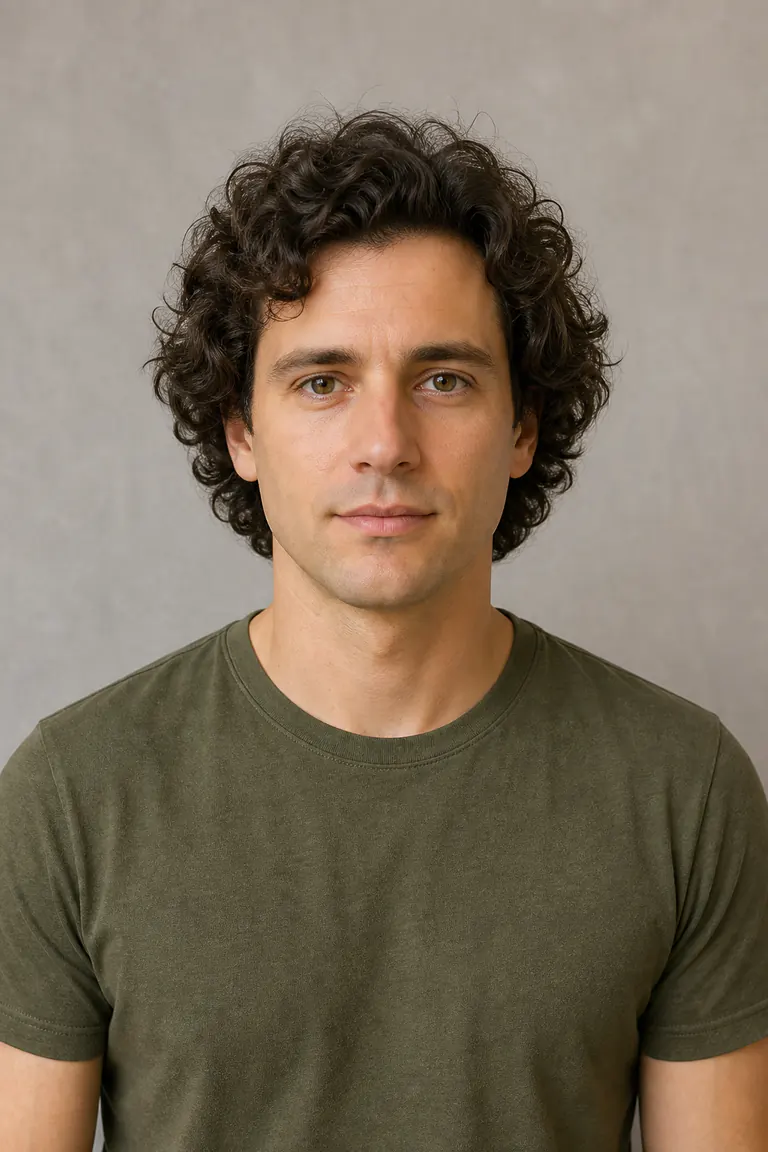 Man with medium-length dark curls before trying a short hairstyle with AI