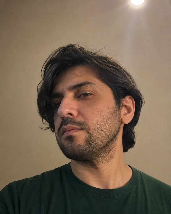 Man in an angled portrait with one temple obscured before virtual glasses try-on