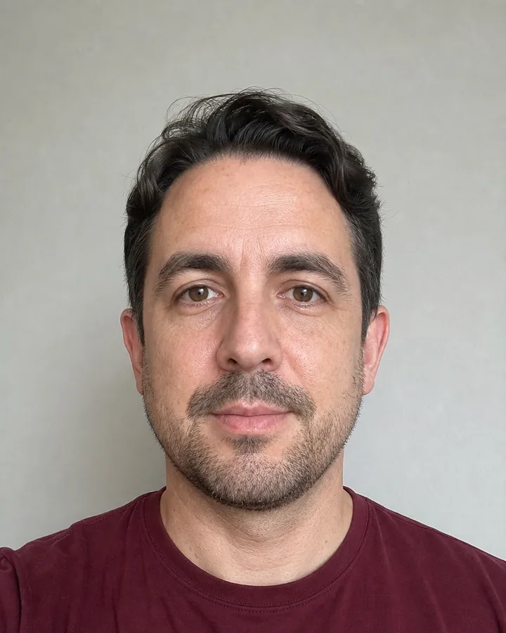 Man in a clear front-facing portrait with both temples visible before virtual glasses try-on
